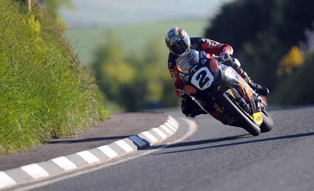 John McGuinness takes his HM Plant Honda Superbike to the fastest lap of Wednesday's practice session